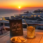 Bar a biarritz rooftop vue mer : cocktail ambré au coucher du soleil